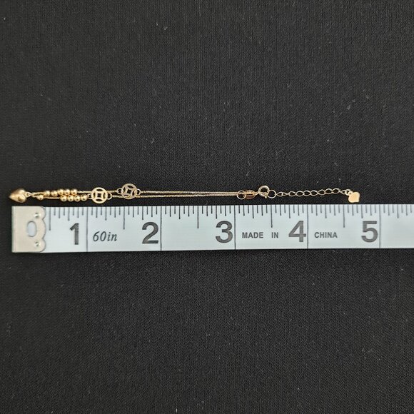 18k Bracelet with small balls and cute money catcher design as charm - Picture 14 of 16